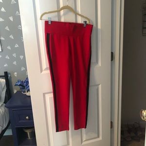 Red leggings with faux leather stripes